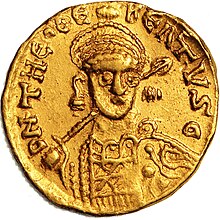 A coin depicting a man's highly stylised crowned head
