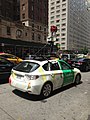 The cameras of this Google Street View car are mounted on the roof rack. The power and data cables are fed into the car through the right rear passenger window.