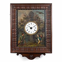 Picture frame timepiece, ca. 1870. Enamel dial in a rectangular painting on a sheet metal: a hunter lies in wait for a hovering bird of prey, while two boys look at the tree stump in which the camouflage cuckoo's door is located (Deutsches Uhrenmuseum, Inv. 05–0962)