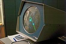 Spacewar on a round monitor on a desk