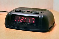 A basic digital clock radio with analog tuning