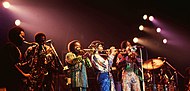 The disco genre was very popular in the decade. Earth, Wind & Fire, one of the most commercially successful disco bands of the era pictured here.