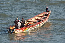 Brightly painted fishing boats are common in Bakau