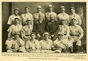 Men wearing light baseball uniforms and caps