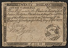 A twenty-dollar banknote issued by South Carolina in 1777 with the inscription: "SOUTH CAROLINA. This Bill intitles the Bearer to Twenty Dollars or Thirty two Pounds ten shillings Current Money of this State pursuant to an Ordinance of the General Assembly passed the 14th Day of Feb. 1777." ; Denominations stated as: "TWENTY DOLLARS" and "L32.10". ; Within emblem: "UBI LIBERTAS IBI PATRIA" ; Verso: "XX Dollars. DEATH TO COUNTERFEIT. L. 32:10:0".