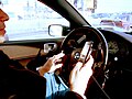 Image 61A driver using two handheld mobile phones at once (from Mobile phone)