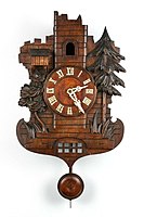 Castle-like ruins clock case with echo. There is a second smaller cuckoo partially visible in the sentry box at left, ca. 1890 (Deutsches Uhrenmuseum, Inv. 1995–638)