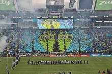A tifo display featuring colored cards held up by fans and a banner reading "Full of Dreams to Last the Years"