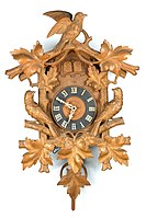 A carved cuckoo and quail clock, ca. 1880 (Deutsches Uhrenmuseum, Inv. 07–2653)
