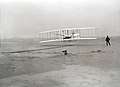 An airplane flying on a beach (from Human history)