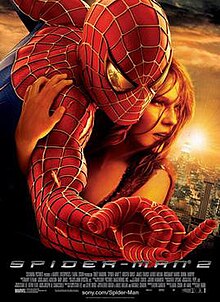 Against a New York City background, a slightly wounded Spider-Man hugs Mary Jane Watson, with a reflection of Doctor Octopus in his eye as he shoots a web.