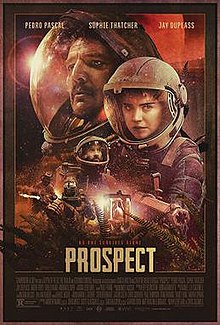 The red-tinted poster shows multiple characters in environmental suits with glass-opening helmets in various close-ups.