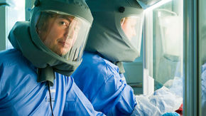 Christian Drosten in PPE in a lab