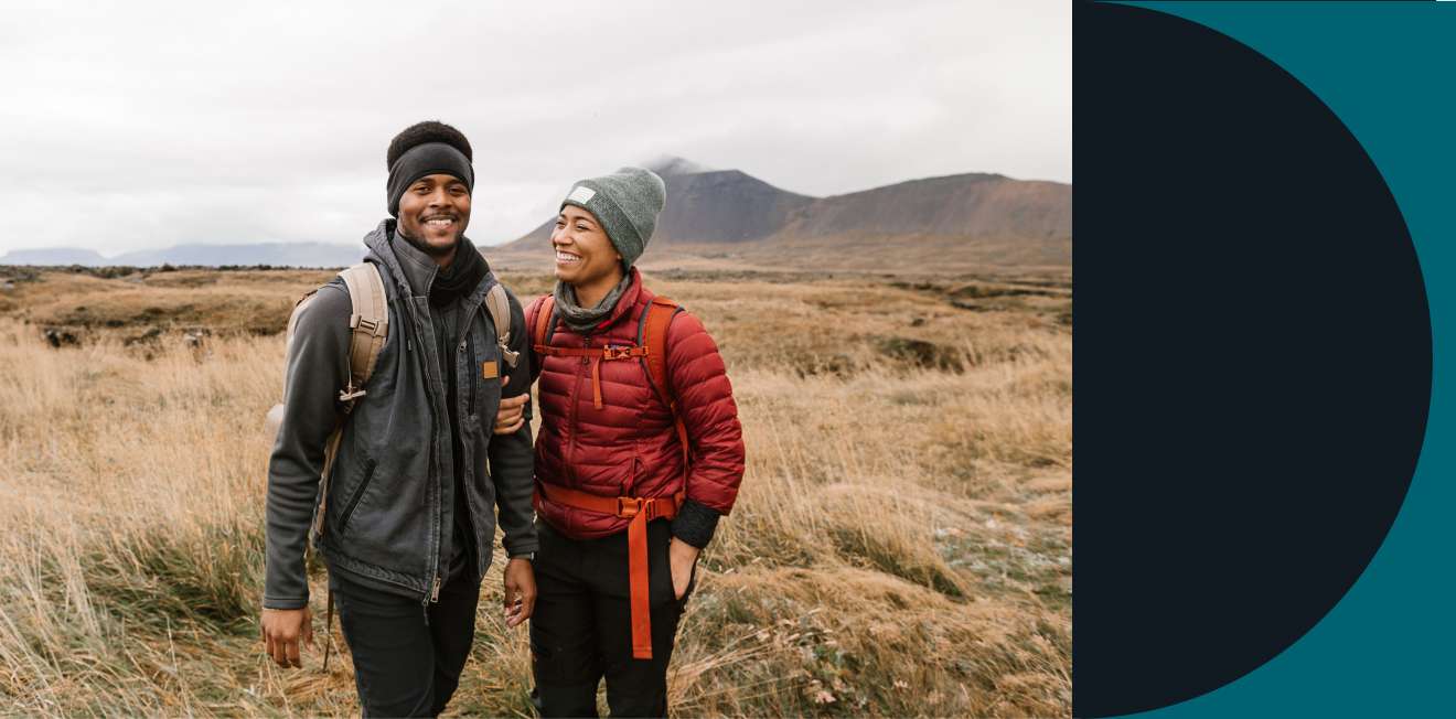 Happy couple in hiking gear
