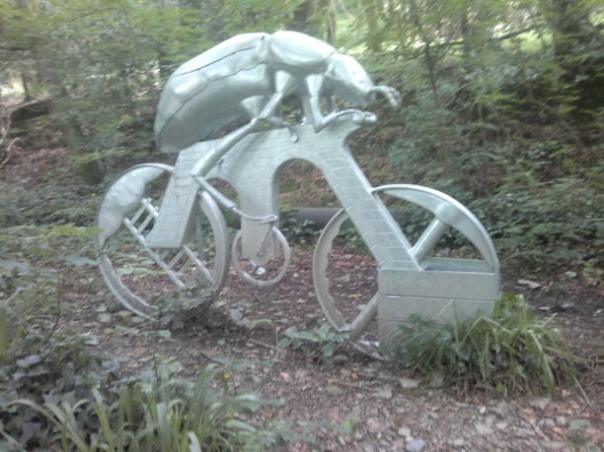sculpture of a cycling insect