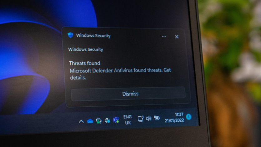 Windows laptop with a security threat popup
