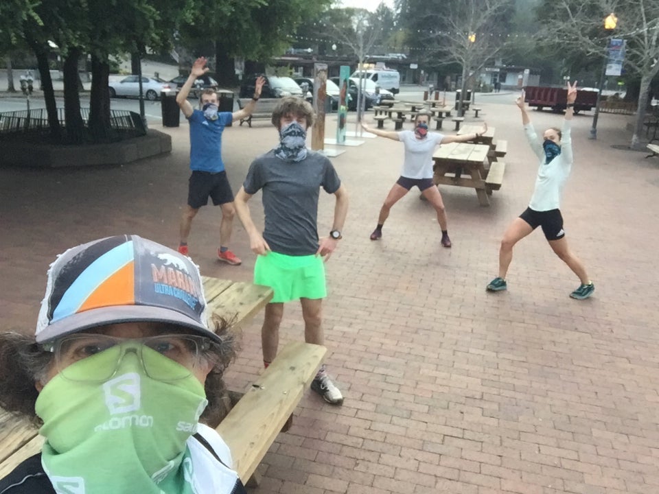 Tantek wearing a buff taking a selfie at the Mill Valley Depot with Nick, Paddy, Olivia, and Emma safely distanced in the background.