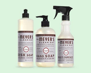 A trio of Mrs. Meyers cleaning products on a mint green background.