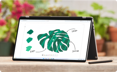 Laptop folded open with an illustrated leaf on the screen