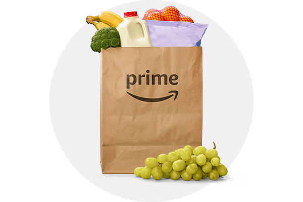 Image of Amazon paper grocery bag with grocery items peaking out of the top and grey circle background