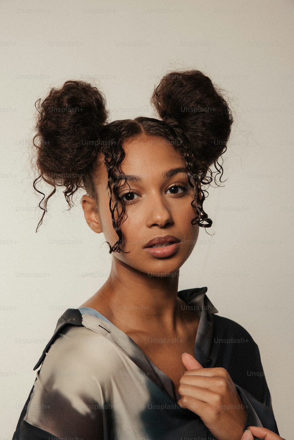 a woman with two buns in her hair