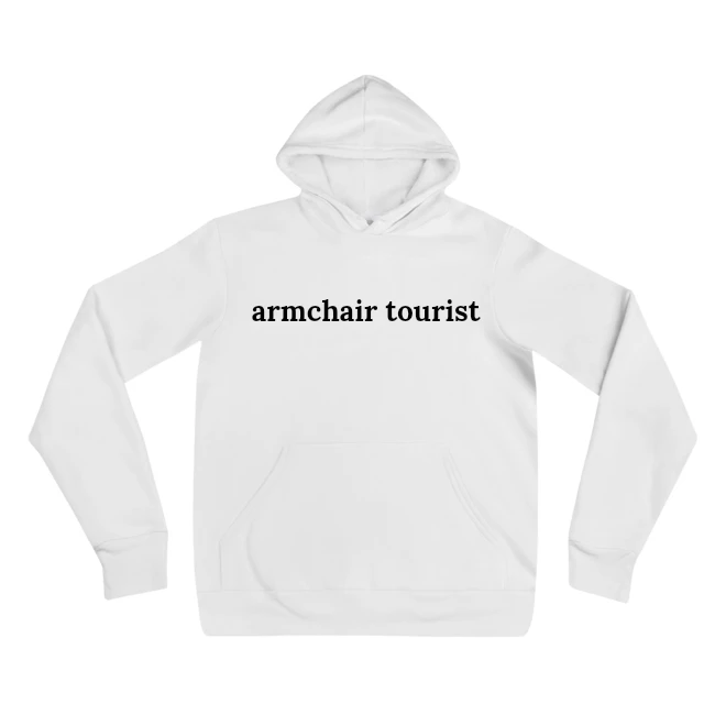 Hoodie with the phrase 'armchair tourist' printed on the front