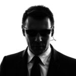 one secret service security bodyguard agent man in silhouette on white background