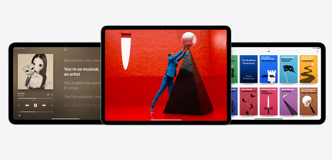 Two iPad Airs and one iPad showcasing the Apple Music, Apple TV+, and Apple Books apps.