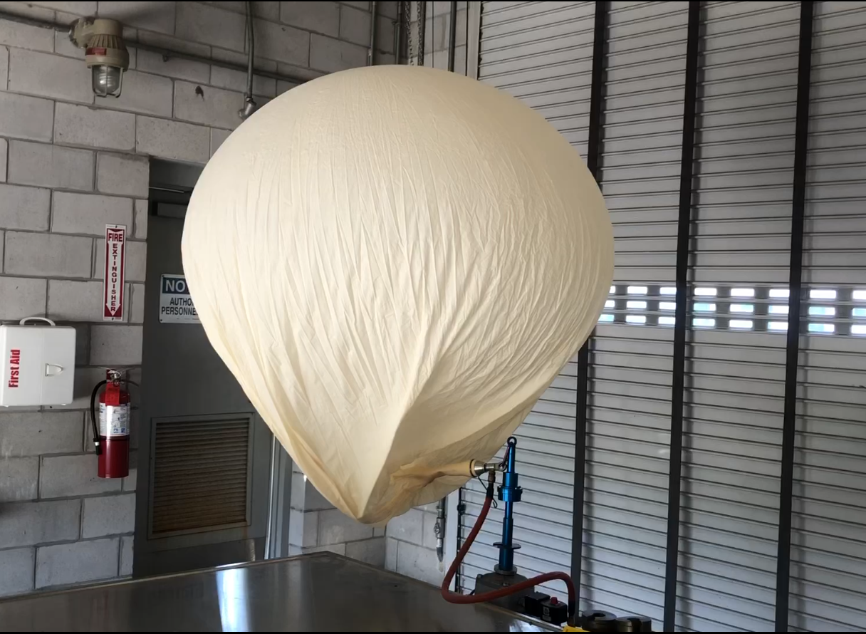 Weather balloon being inflated with helium for launch at the National Weather Service. 